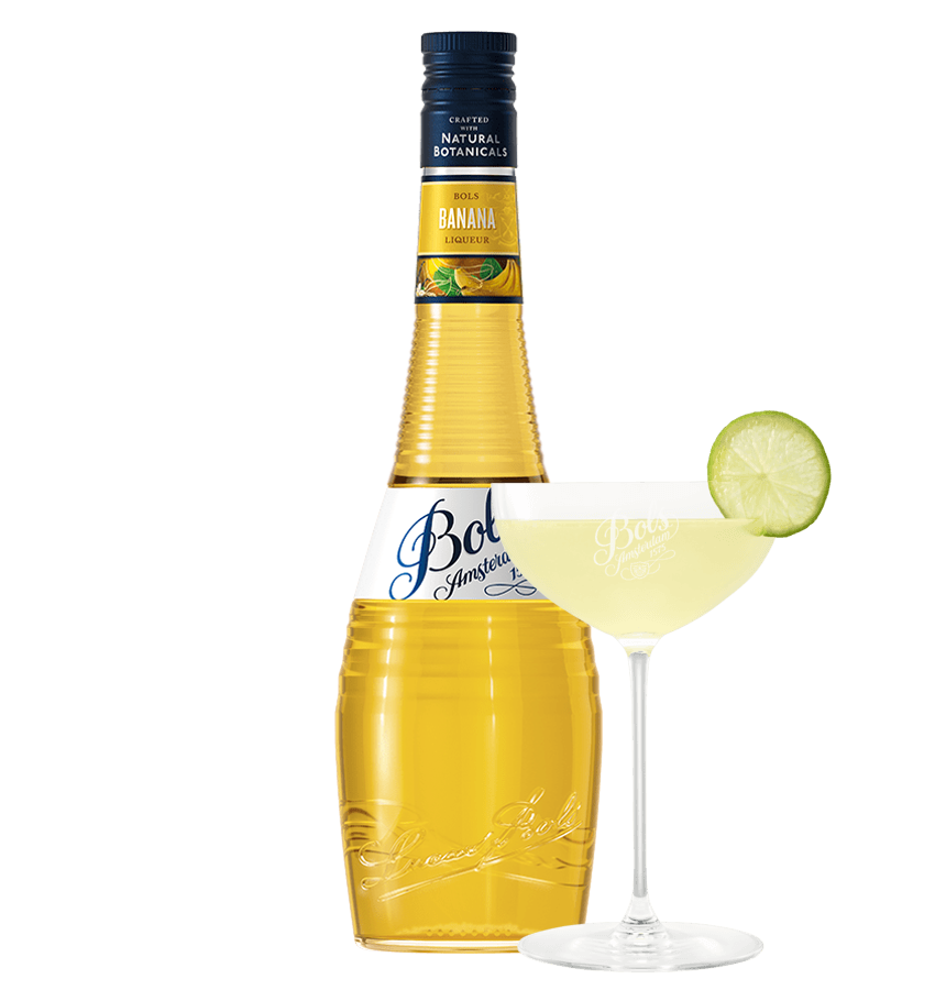 Bottle of Bot Banana liqueur with a cocktail and lime wedge on a white background