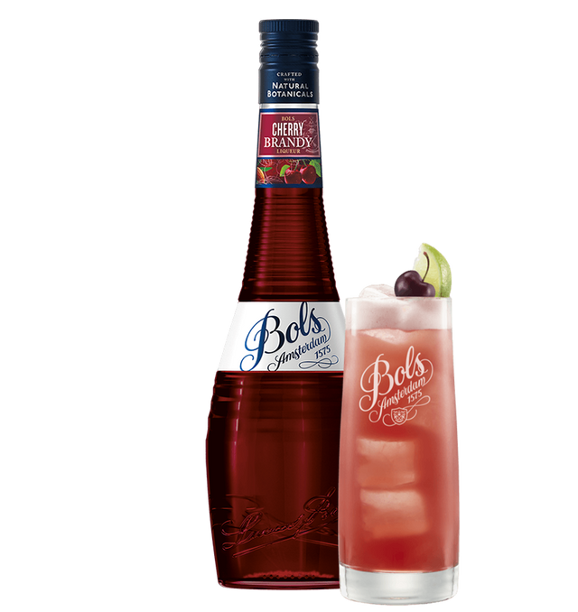Bols Cherry Brandy liqueur bottle with a cherry and lime garnish on a white background