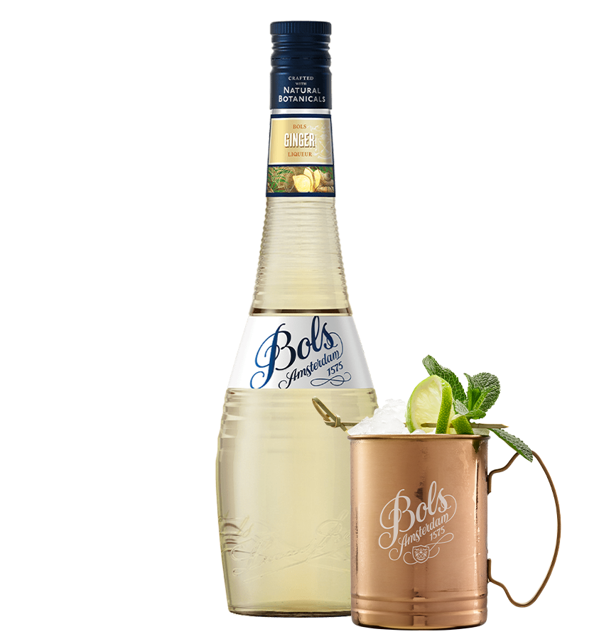Bols Ginger liqueur bottle with a copper mug garnished with lime and mint leaves on a white background