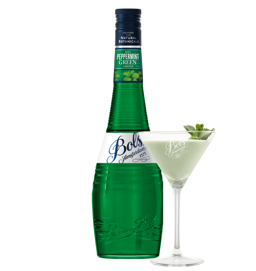 Green bottle of Bols Peppermint Green liqueur with a glass of the liqueur garnished with mint leaves on a white background.
